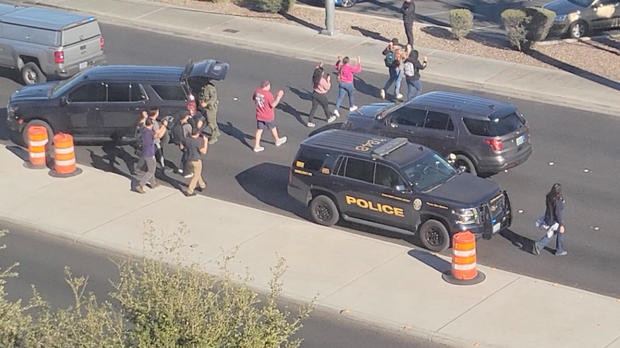 People Leave Campus With Raised Hands Following Reports Of A Shooting At The University Of Nevada Campus Of Las Vegas, Dec. 6, 2023.